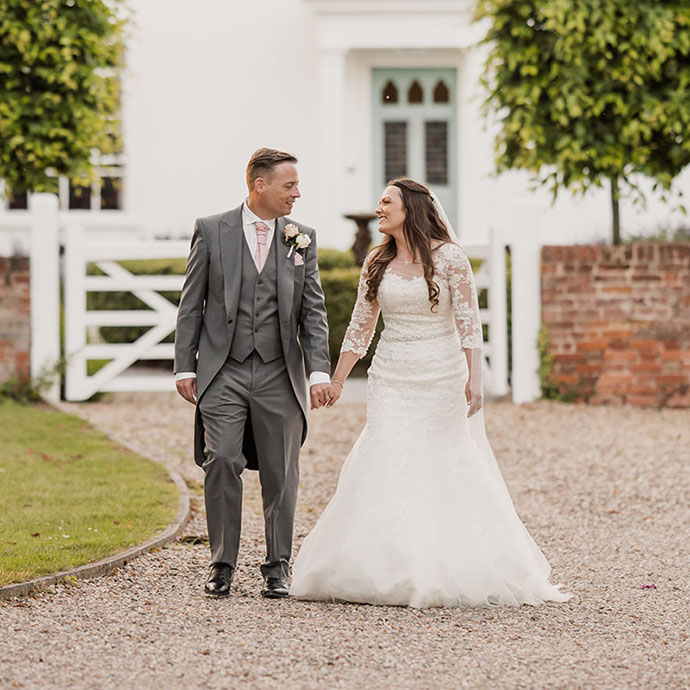 Newly wed couple outside Vaulty Manor in Essex - Camellio Wedding Planning and Events - Essex Wedding Planner